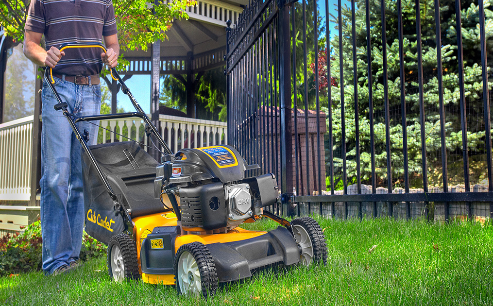 man mowing on pro cub cadet model